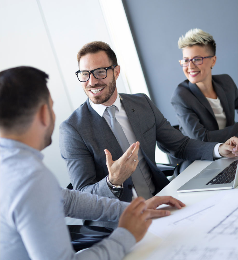 Investors sitting at table having a pleasant conversation